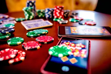 A glowing roulette wheel with cascading chips, symbolizing the engaging live and instant-win games available on AB9999.