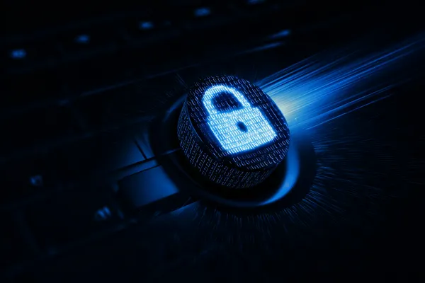 A laptop glowing with a bright login prompt in a minimalistic setup, symbolizing the protected access system at AB9999.